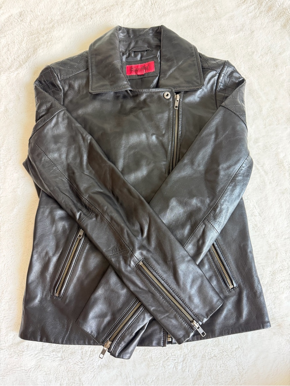 Sleek Black Leather Moto Jacket with Zip Details